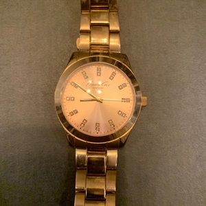 Kenneth Cole rose gold wrist watch for women.